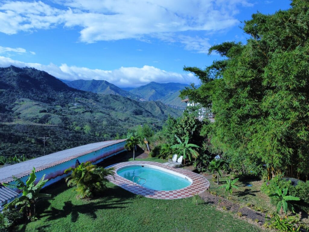 Green mountain landscape and grounds of Yogendra Ashram in Cali