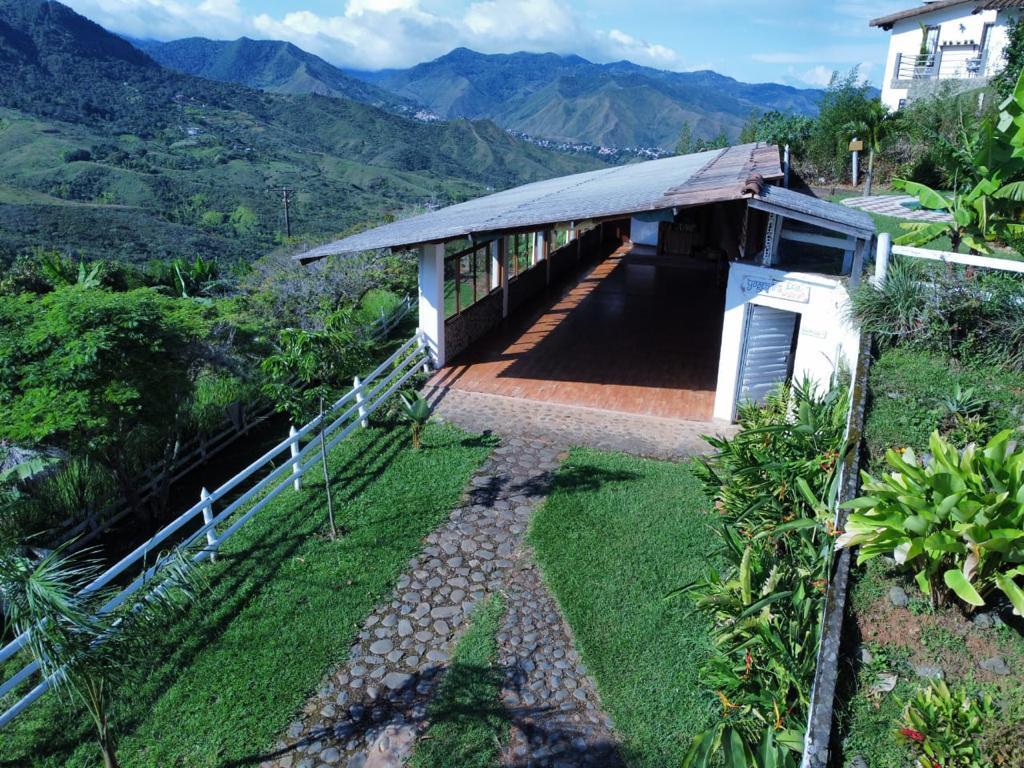 Yogendra Ashram yoga shala overlooking the green mountains near Cali