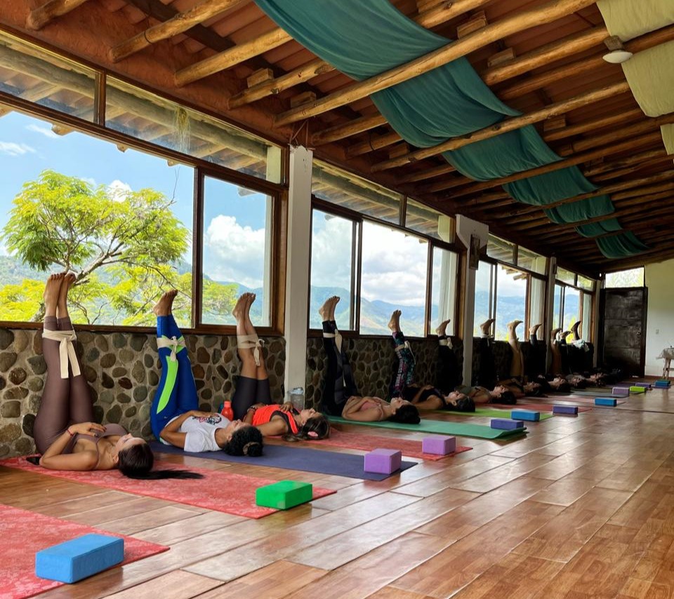 Students practicing legs up the wall at Yogendra Ashram in Cali