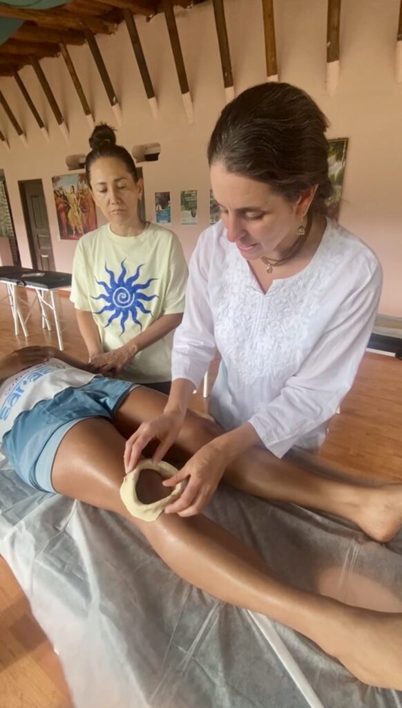 Guided Knee Basti practice during Ayurveda training in Cali