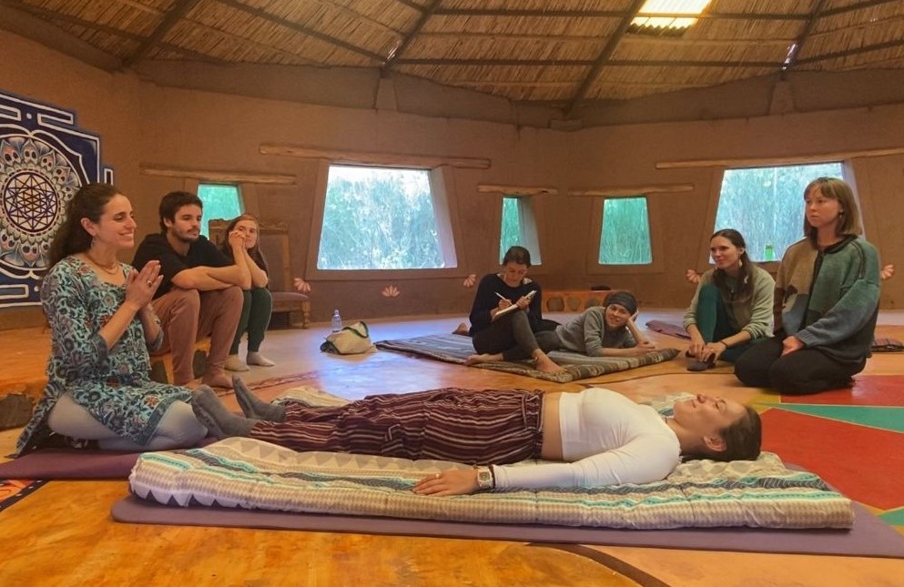 Shyam demonstrating Thai Yoga Massage to students in Cusco