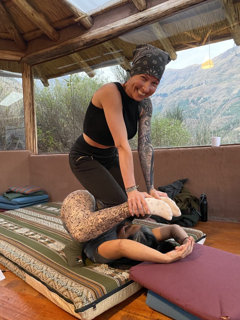 A Thai Massage student practicing mindful foot work in Cusco