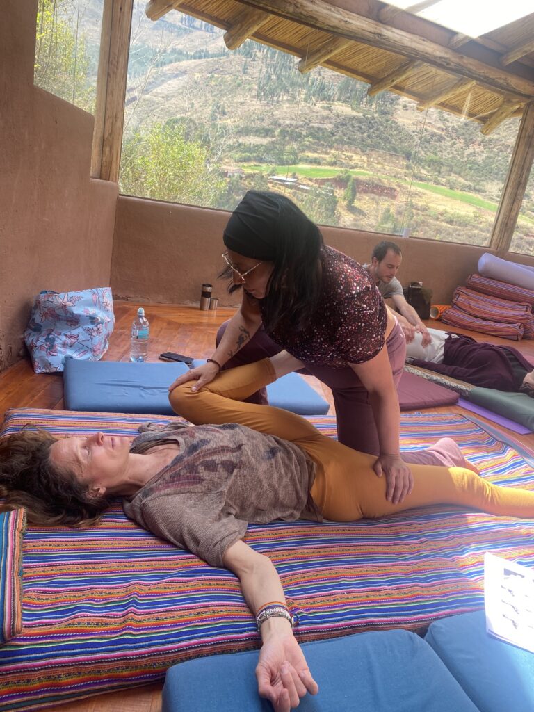 Attentive leg compression during partner practice in Cusco