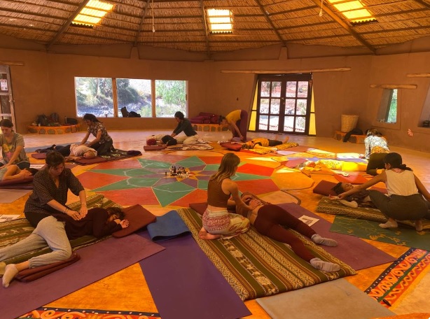 Thai Yoga Massage students practicing in pairs in Cusco
